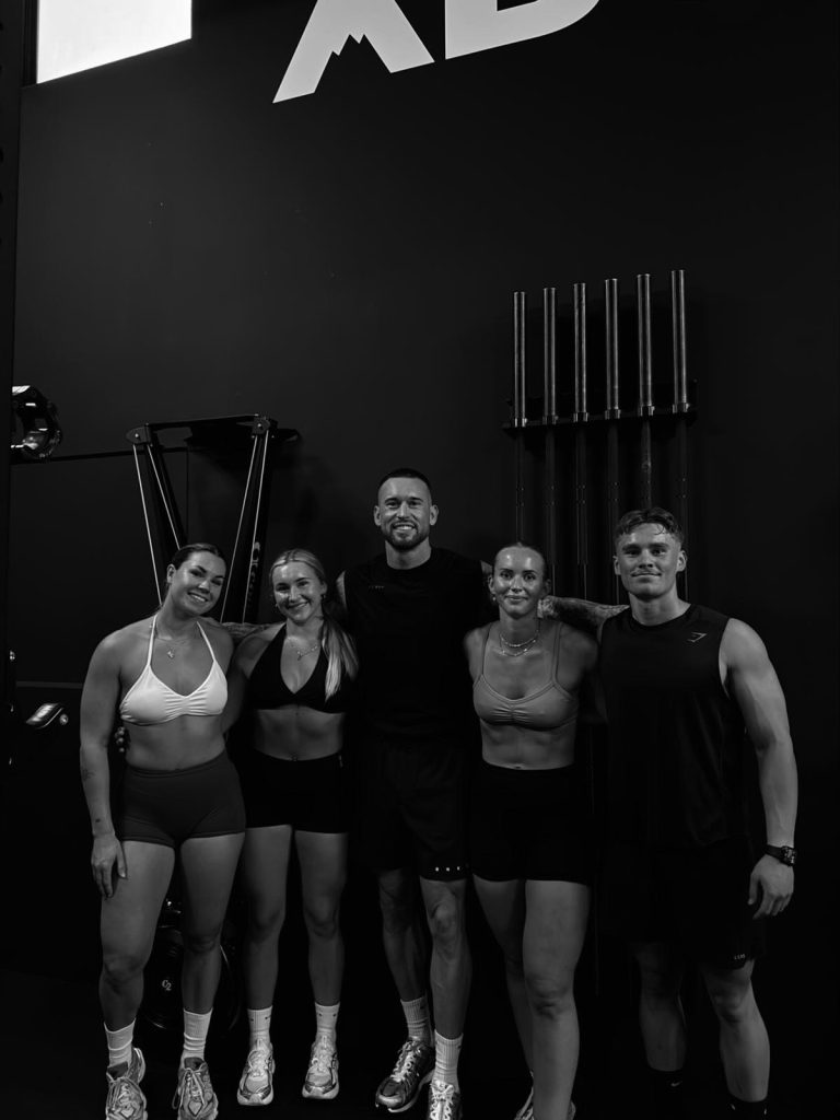 ABOVE Gym members and coach together inside the gym